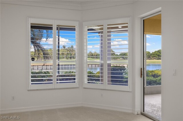 1880 Les Chateaux Blvd Unit 104, Naples, FL 34109 - carpeted spare room with a water view and baseboards