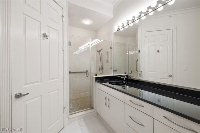 1880 Les Chateaux Blvd Unit 104, Naples, FL 34109 - bathroom featuring a stall shower, vanity, and tile patterned flooring
