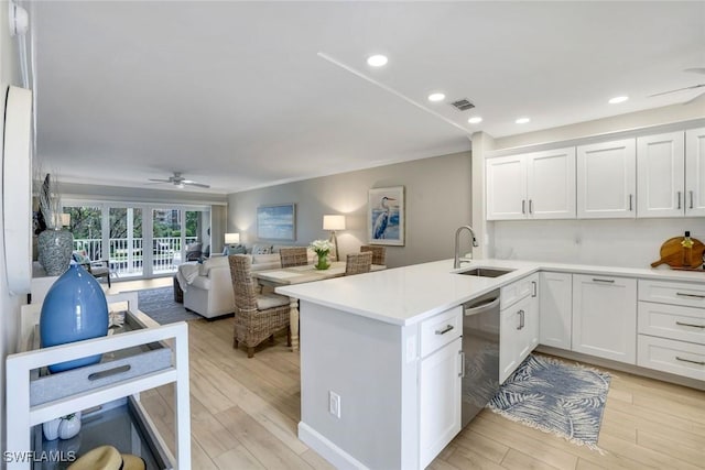 169 S Collier Blvd Unit H203, Marco Island, FL 34145 - kitchen with dishwasher, a peninsula, white cabinetry, open floor plan, and ceiling fan