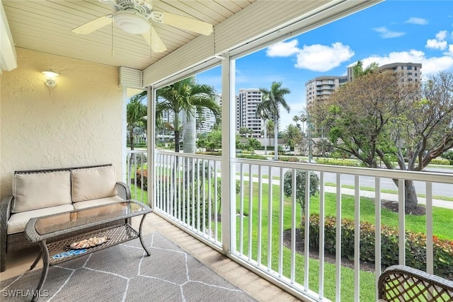 169 S Collier Blvd Unit H203, Marco Island, FL 34145 - sunroom featuring a ceiling fan and an outdoor living space