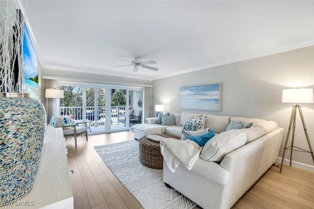 169 S Collier Blvd Unit H203, Marco Island, FL 34145 - living room with crown molding, a ceiling fan, wood finished floors, and french doors