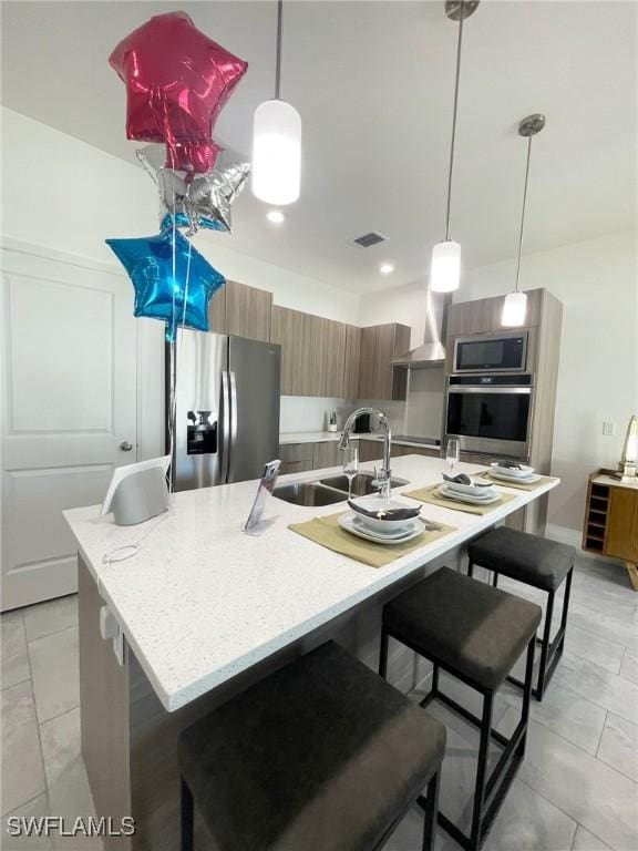 8029 Sandy Cir, Labelle, FL 33935 - kitchen with stainless steel appliances, modern cabinets, a sink, a breakfast bar area, and recessed lighting