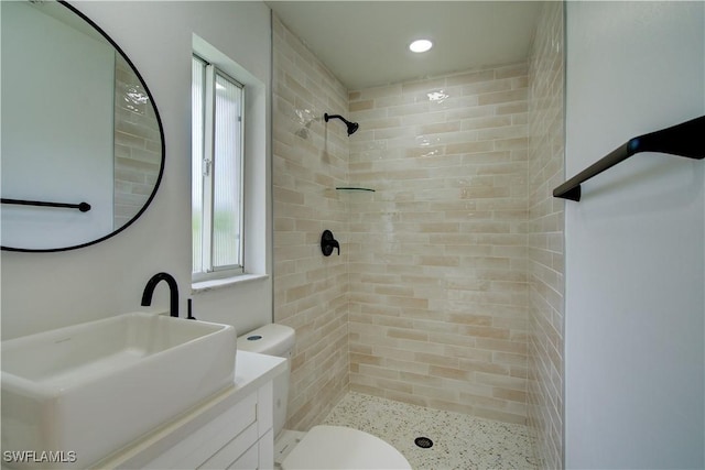 32 Fairview Blvd, Fort Myers Beach, FL 33931 - bathroom featuring vanity, a tile shower, toilet, and recessed lighting