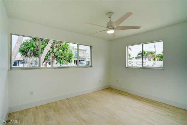 32 Fairview Blvd, Fort Myers Beach, FL 33931 - unfurnished room with baseboards, wood finished floors, and a ceiling fan