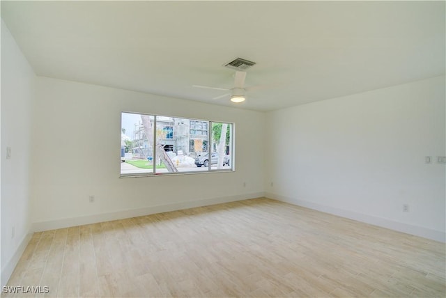 32 Fairview Blvd, Fort Myers Beach, FL 33931 - spare room with light wood-style flooring, ceiling fan, and baseboards