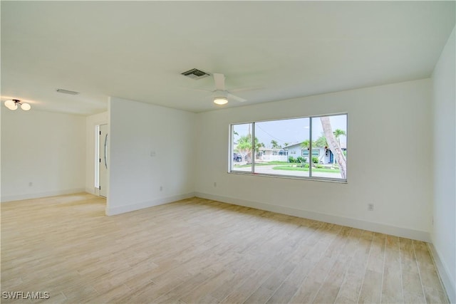 32 Fairview Blvd, Fort Myers Beach, FL 33931 - spare room with light wood-style flooring, a ceiling fan, and baseboards