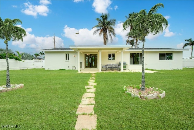32 Fairview Blvd, Fort Myers Beach, FL 33931 - back of property featuring stucco siding and a patio area