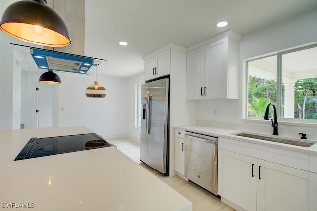 32 Fairview Blvd, Fort Myers Beach, FL 33931 - kitchen with appliances with stainless steel finishes, a sink, recessed lighting, light countertops, and white cabinets