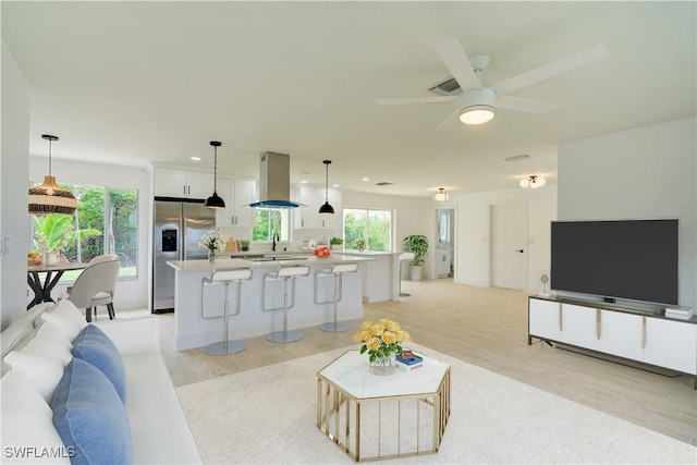 32 Fairview Blvd, Fort Myers Beach, FL 33931 - living room with light wood-style flooring, plenty of natural light, ceiling fan, and recessed lighting