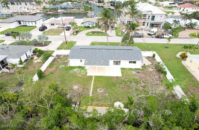 32 Fairview Blvd, Fort Myers Beach, FL 33931 - aerial view of property and surrounding area with nearby suburban area and a large body of water