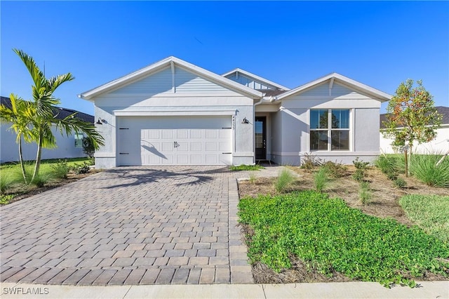 44204 Kelly Dr, Punta Gorda, FL 33982 - ranch-style home featuring decorative driveway, a garage, and stucco siding