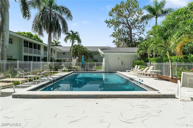 4126 Belair Ln Unit C6, Naples, FL 34103 - community pool featuring a patio