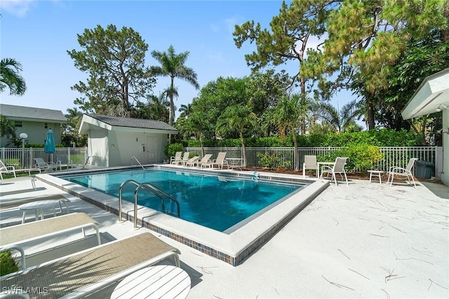 4126 Belair Ln Unit C6, Naples, FL 34103 - community pool featuring a patio area