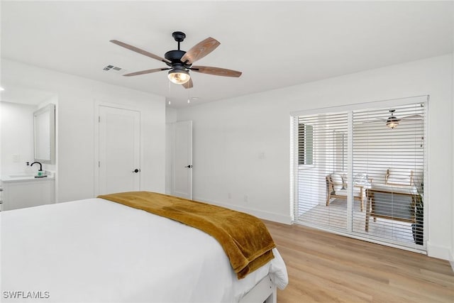 4126 Belair Ln Unit C6, Naples, FL 34103 - bedroom with light wood-style floors, baseboards, ceiling fan, and a sink