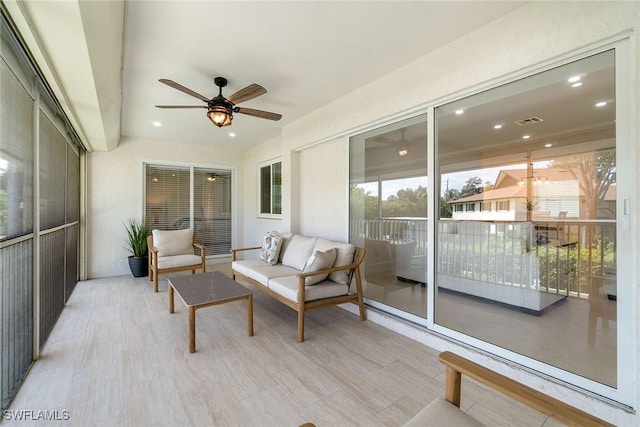 4126 Belair Ln Unit C6, Naples, FL 34103 - sunroom with a ceiling fan and an outdoor living space