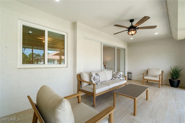 4126 Belair Ln Unit C6, Naples, FL 34103 - living room featuring ceiling fan, recessed lighting, light wood finished floors, and a textured wall