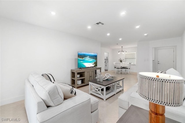 4126 Belair Ln Unit C6, Naples, FL 34103 - living room with light tile patterned floors, recessed lighting, and baseboards