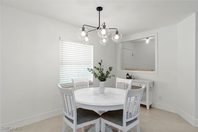 4126 Belair Ln Unit C6, Naples, FL 34103 - dining area featuring a chandelier, baseboards, and light tile patterned floors