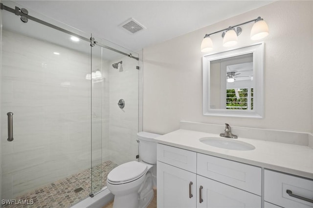 1549 Sandpiper St Unit 59, Naples, FL 34102 - full bath featuring a shower stall, vanity, toilet, and ceiling fan