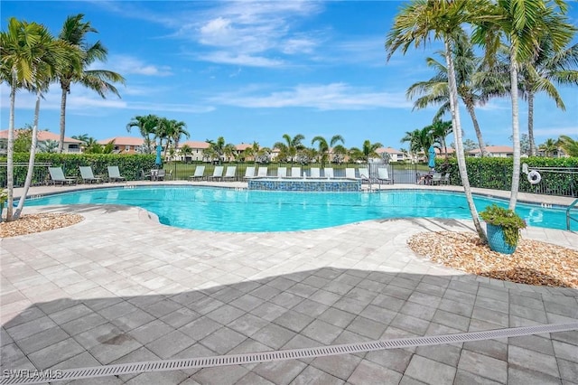 18273 Creekside Preserve Loop Unit 101, Fort Myers, FL 33908 - community pool featuring a patio area