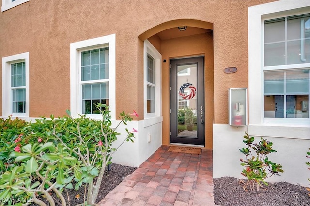 18273 Creekside Preserve Loop Unit 101, Fort Myers, FL 33908 - doorway to property featuring stucco siding
