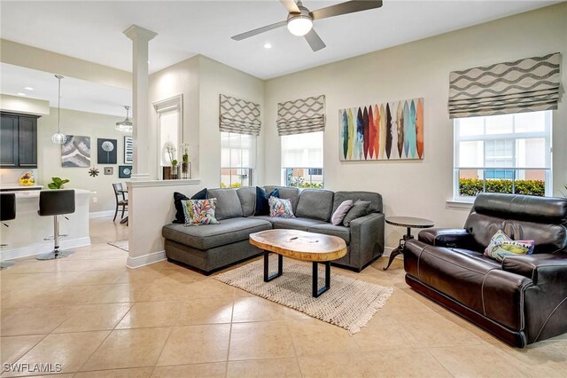18273 Creekside Preserve Loop Unit 101, Fort Myers, FL 33908 - living area with plenty of natural light, a ceiling fan, light tile patterned floors, ornate columns, and recessed lighting