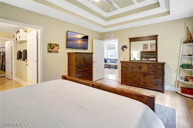 18273 Creekside Preserve Loop Unit 101, Fort Myers, FL 33908 - bedroom with crown molding, wood finished floors, and a tray ceiling