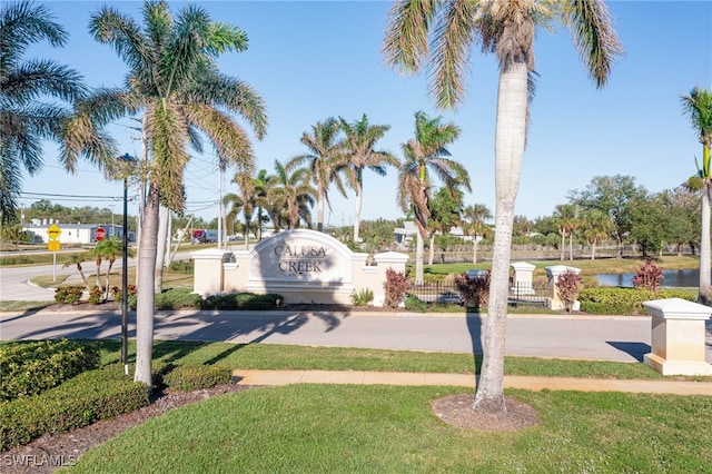 5213 Shell Mound Cir, Punta Gorda, FL 33982 - view of asphalt street featuring traffic signs and a water view