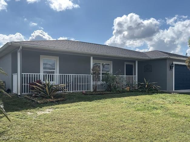 1220 Moore Run, Labelle, FL 33935 - rear view of house featuring an attached garage, stucco siding, a lawn, and a porch