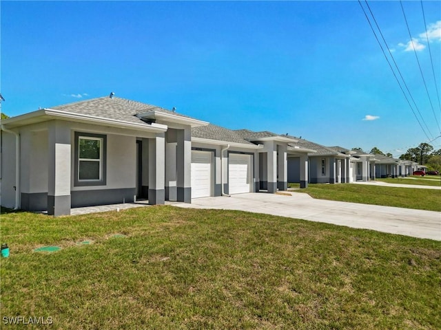 1404 W 12th St, Lehigh Acres, FL 33972 - prairie-style home featuring an attached garage, concrete driveway, a front lawn, and stucco siding