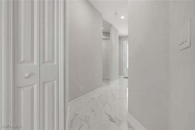 1404 W 12th St, Lehigh Acres, FL 33972 - corridor with light marble finish floors, baseboards, and recessed lighting
