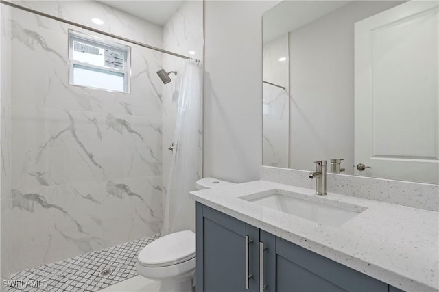 1404 W 12th St, Lehigh Acres, FL 33972 - bathroom with vanity, toilet, and a marble finish shower