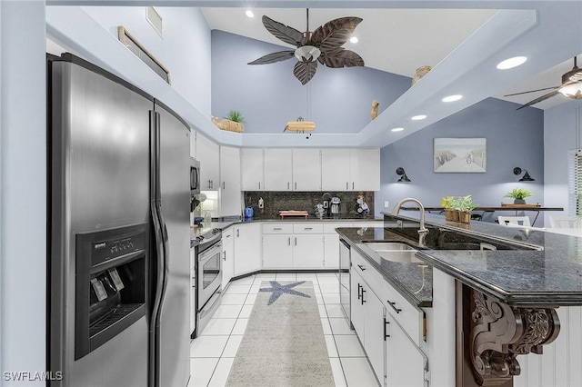 13460 Wild Cotton Ct, North Fort Myers, FL 33903 - kitchen with stainless steel appliances, ceiling fan, light tile patterned floors, recessed lighting, and backsplash