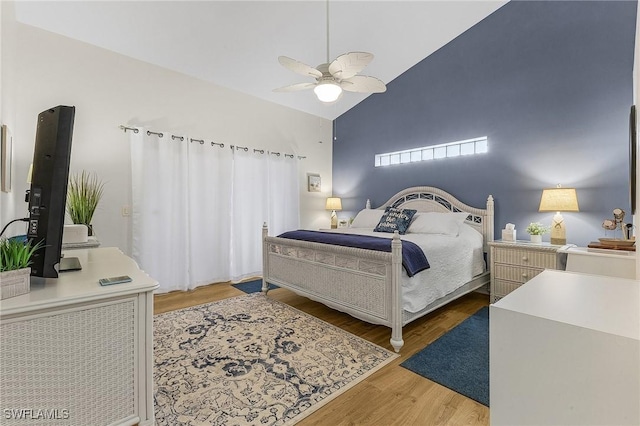 13460 Wild Cotton Ct, North Fort Myers, FL 33903 - bedroom with wood finished floors, vaulted ceiling, and a ceiling fan