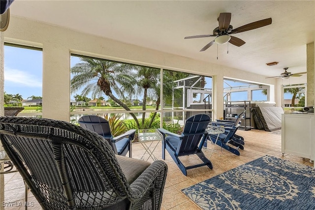 13460 Wild Cotton Ct, North Fort Myers, FL 33903 - sunroom featuring ceiling fan and a water view