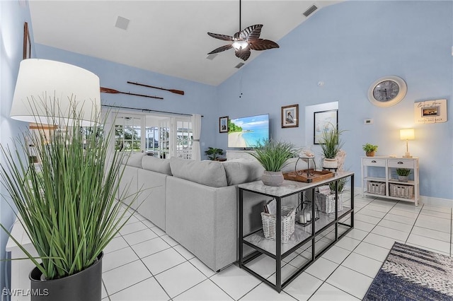 13460 Wild Cotton Ct, North Fort Myers, FL 33903 - living area with light tile patterned floors, high vaulted ceiling, ceiling fan, and baseboards