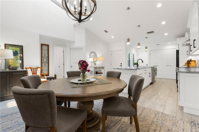 4014 Crayton Rd Unit B4, Naples, FL 34103 - dining room with a chandelier, recessed lighting, vaulted ceiling, and light wood finished floors