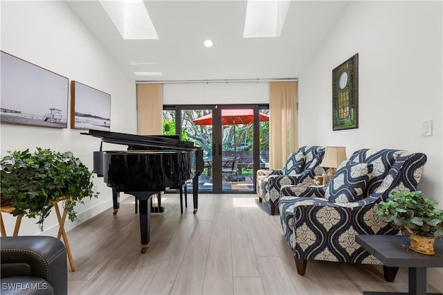 4014 Crayton Rd Unit B4, Naples, FL 34103 - living area featuring a skylight, vaulted ceiling, wood finished floors, and recessed lighting