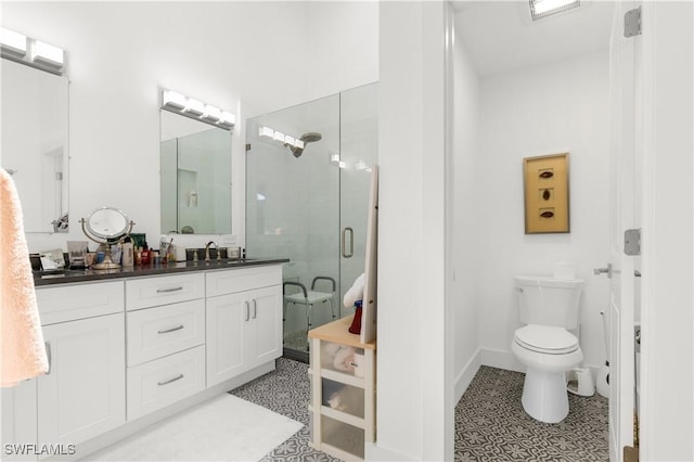 4014 Crayton Rd Unit B4, Naples, FL 34103 - full bathroom with double vanity, a shower stall, toilet, and baseboards