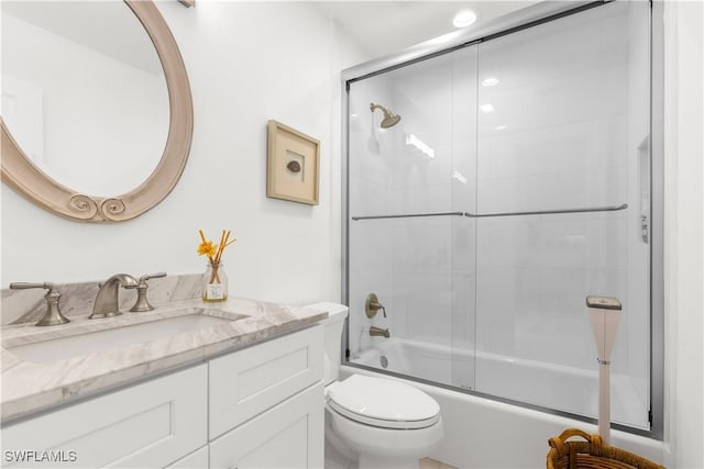 4014 Crayton Rd Unit B4, Naples, FL 34103 - full bathroom with vanity, toilet, and bath / shower combo with glass door