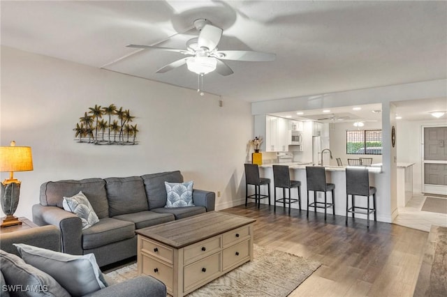 4719 SE 17th Pl Unit 103, Cape Coral, FL 33904 - living area with ceiling fan and wood finished floors