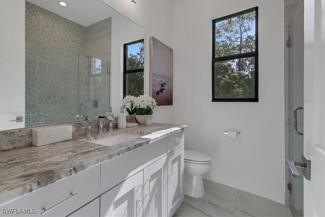 4472 Pine Ridge Rd, Naples, FL 34119 - bathroom with vanity, healthy amount of natural light, toilet, and a stall shower