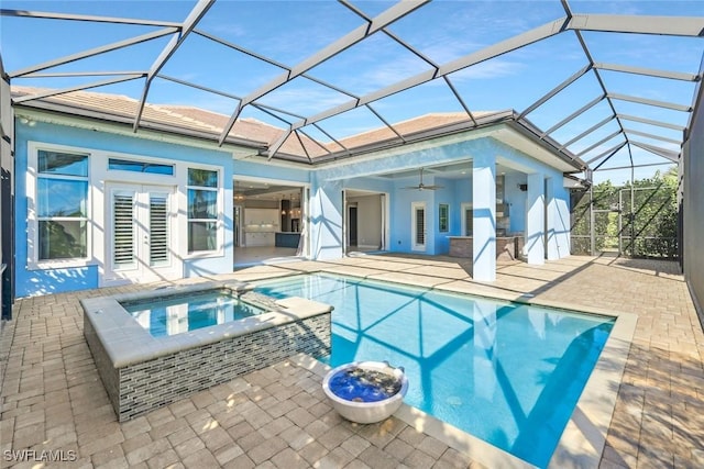 14792 Spinnaker Way, Naples, FL 34114 - back of property with a patio, a ceiling fan, a pool with connected hot tub, a lanai, and stucco siding