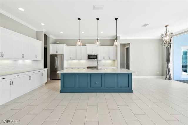 14792 Spinnaker Way, Naples, FL 34114 - kitchen featuring appliances with stainless steel finishes, light countertops, backsplash, ornamental molding, and white cabinetry