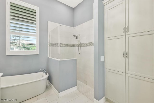 14792 Spinnaker Way, Naples, FL 34114 - bathroom featuring walk in shower, a soaking tub, and tile patterned flooring