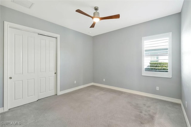 14792 Spinnaker Way, Naples, FL 34114 - unfurnished bedroom featuring carpet floors, a closet, and ceiling fan