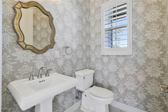 14792 Spinnaker Way, Naples, FL 34114 - bathroom with toilet and wallpapered walls