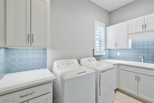 14792 Spinnaker Way, Naples, FL 34114 - laundry room with separate washer and dryer, cabinet space, and light tile patterned flooring