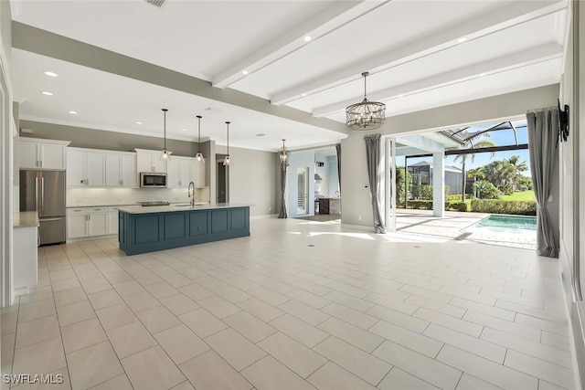 14792 Spinnaker Way, Naples, FL 34114 - kitchen featuring stainless steel appliances, open floor plan, backsplash, white cabinetry, and light countertops