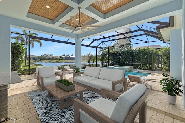 14792 Spinnaker Way, Naples, FL 34114 - view of patio featuring a water view, a ceiling fan, an outdoor living space, a lanai, and a pool with connected hot tub